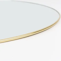Espejo de pared redondo de metal dorado Orión Ø55cm