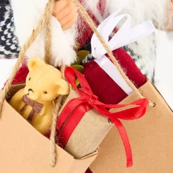 Figura decorativa Santa Claus con bolsa regalos y peluche 30cm
